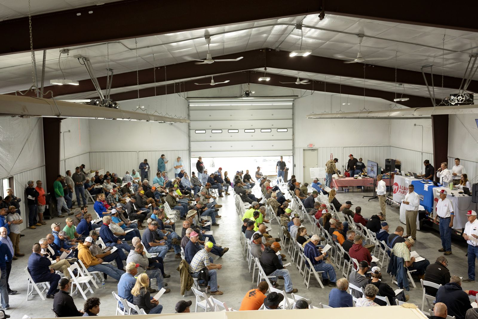 Crowd at the Blessing Construction live auction in the Adam Marshall Land & Auction sale barn, Kearney, Nebraska